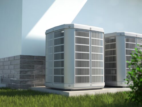 High-efficiency air conditioners installed outside of a home
